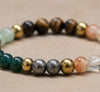 Multicolored beaded bracelet on a beige surface
