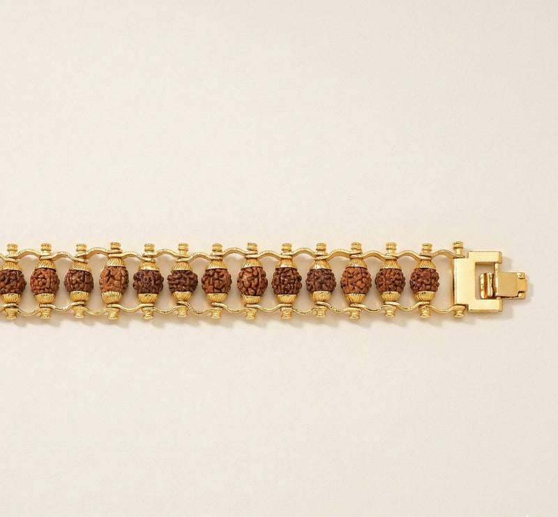 Gold bracelet with brown beads on a beige background