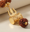 Gold pendant with rudraksha beads on a beige background