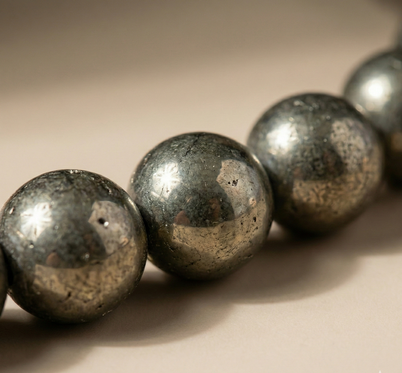 Close-up of metallic beads on a beige background