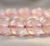 Close-up of pink gemstone beads on a blurred background