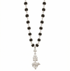 Black beaded necklace with a silver pendant on a white background
