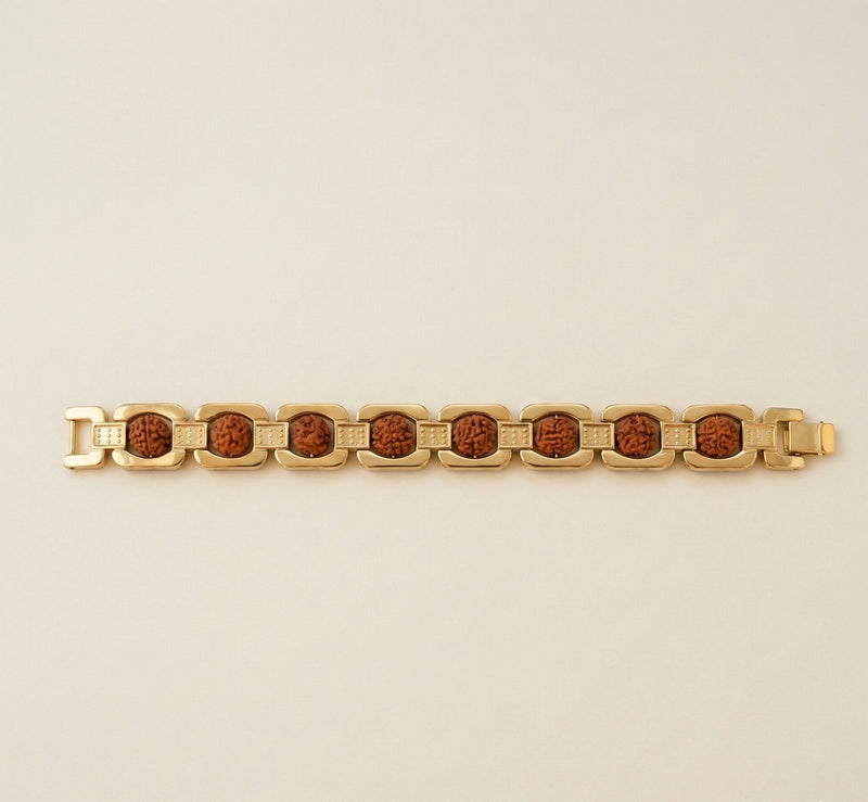 Gold bracelet with brown stones on a beige background