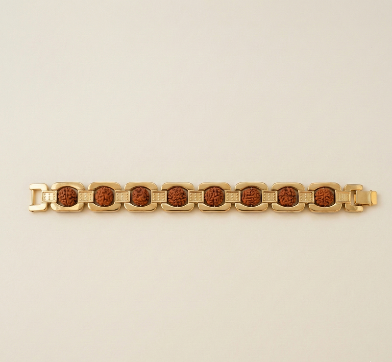 Gold bracelet with brown stones on a beige background