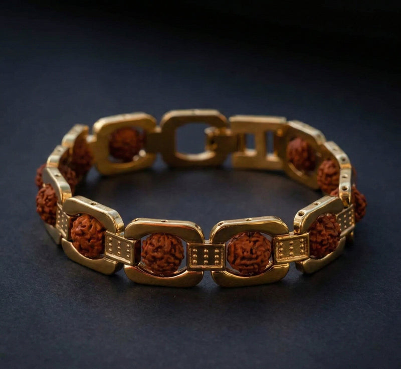 Gold bracelet with brown beads on a dark background